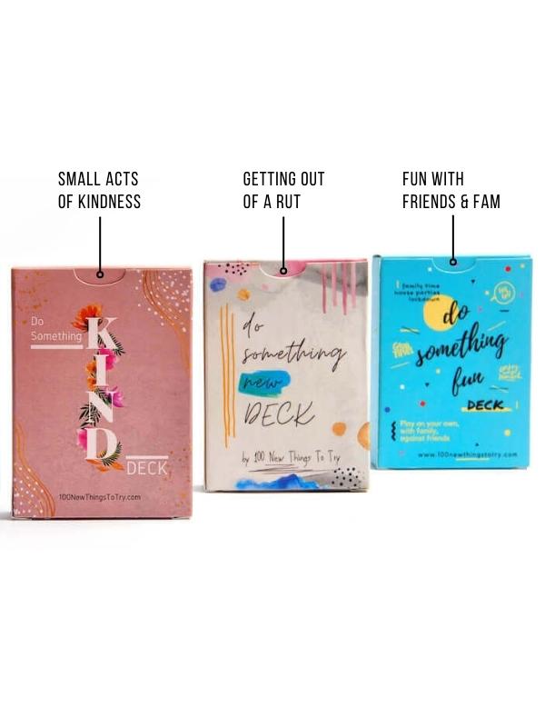 Three decks of cards with tags saying what they do. The decks are called Do Something New Deck (it's tag says Getting out of a rut), Do Something Fun Deck (Tag saying Fun with friends & Fam) and Do Something Kind Deck (tag saying Small Acts of Kindness.
